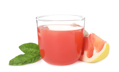 Glass of pink pomelo juice, fruit and green leaves isolated on white