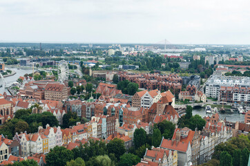Fototapeta na wymiar POLAND, GDANSK: Scenic landscape view of city old center with traditional architecture with red roofs