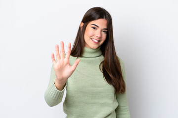 Young Brazilian woman isolated on white background counting five with fingers