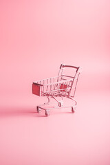pink grocery basket on a pink background