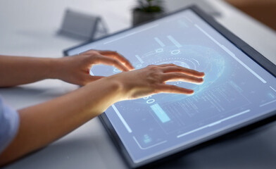 technology, virtual reality and people concept - hands on led light tablet or touch screen at office
