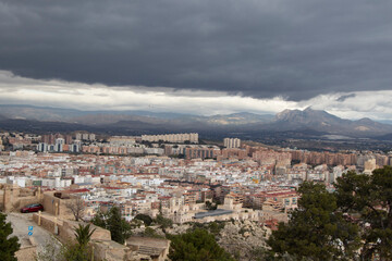 Fototapeta na wymiar panorama view of the city under black rainy sky, view of Alicante