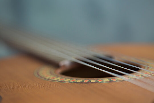 Selective focus. Classical music.Closeup image of an acoustic guitar. Music background. Detail