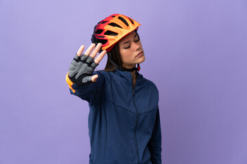 Teenager cyclist girl making stop gesture and disappointed - obrazy, fototapety, plakaty