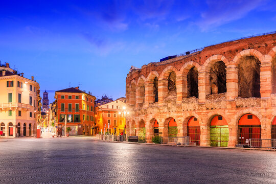 Roman amphitheatre Arena di Verona and Piazza Bra square at night