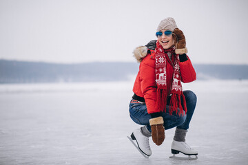 Woman ice skating at the lake