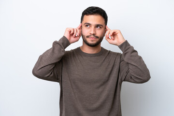 Fototapeta premium Young Brazilian man isolated on white background having doubts and thinking
