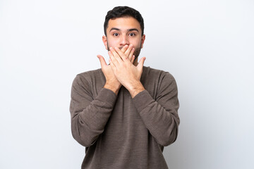 Young Brazilian man isolated on white background covering mouth with hands