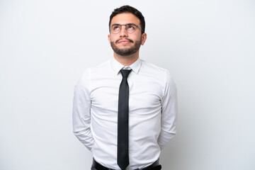 Business Brazilian man isolated on white background and looking up