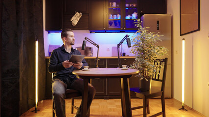 Male host on studio live podcast listening to plant guest surrounded with kitchen - obrazy, fototapety, plakaty