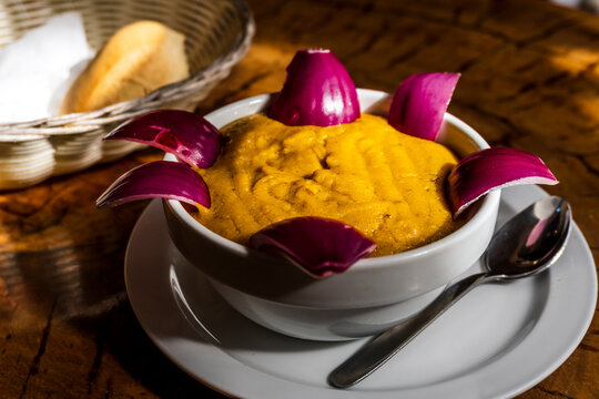 Traditional food from Gran Canaria called Gofio Escaldado is to be eaten with raw red onion.