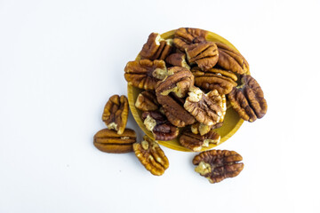 Obraz premium Pecan nuts isolated on white background