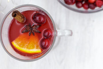 Beautiful fragrant hot drink with cranberries and spices. Christmas or autumn mood.