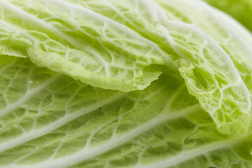Chinese cabbage leaf close-up, vegetarian diet, food background.