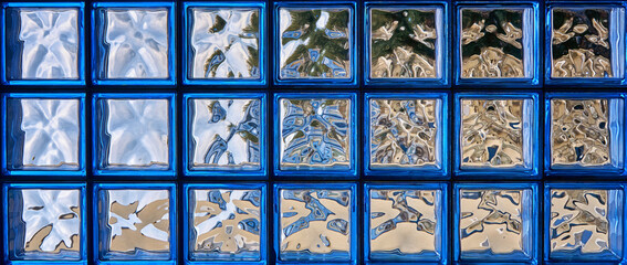 Pattern of blue glass block wall as panoramic background for abstract works.
