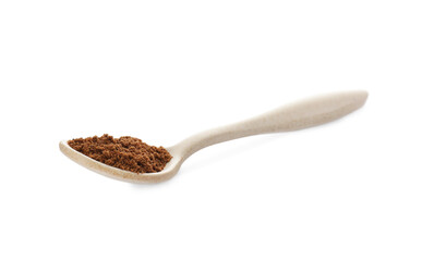 Spoon with nutmeg powder on white background