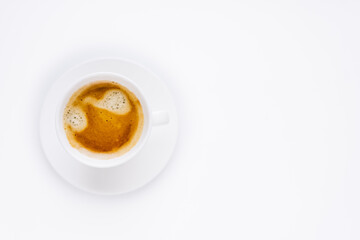 a white cup of coffee with a beautiful foam on a white background. 