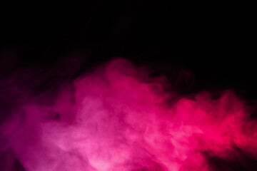 close-up of floating colorful steam smoke spray isolated on a black background