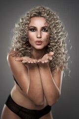 Glamour model with curly blond hair