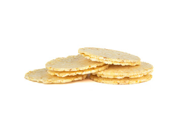 Thin round cornbread on a white background.