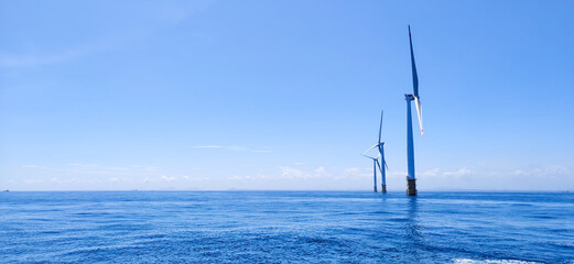 wind turbine to convert the wind's kinetic energy into electricity in Pearl River Estuary, China,...