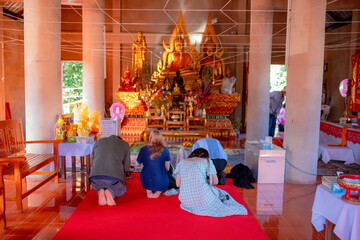 Travel to pay homage to monks in Thailand.