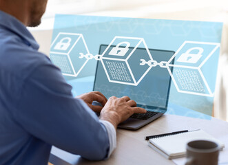 European young businessman working on computer, double exposure with abstract blocks and locks, digital hologram