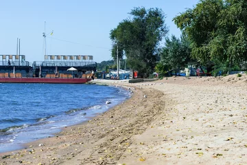 Foto op Plexiglas sea of Azov, Mariupol, Donetsk region, beach coastline with seascape and pier in the distance © Natalia