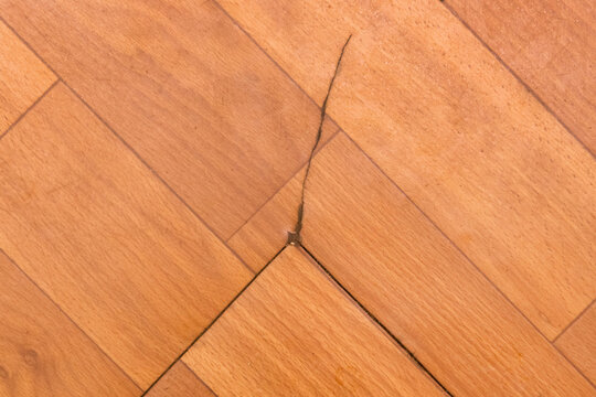 Broken torn linoleum old rubber polymer PVC floor damage material, flooring repair