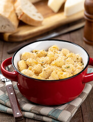 Macaroni and cheese in a red dish