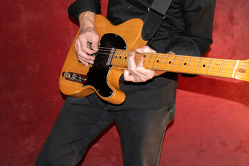 Artist with a Telecaster natural electric guitar