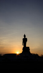 blurry images Beautiful Buddha statue in the evening sunset, Thailand