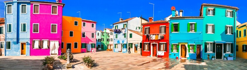 Fototapeta na wymiar Most colorful places (towns) - Burano island, village with vivid houses near Venice, Italy travel and landmarks
