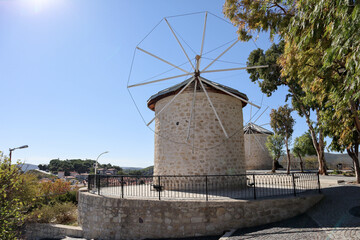 Fototapeta na wymiar traditional windmill in Alacati, Turkey in sunny autumn day with blue sky on background