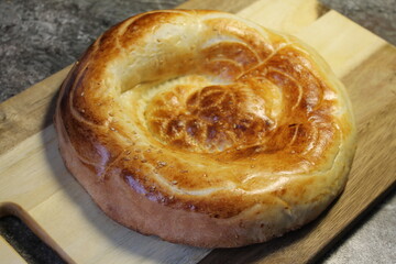 Traditional asian plate bread on a wooden board