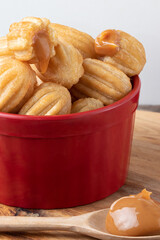 Mini churros stuffed with dulce de leche.