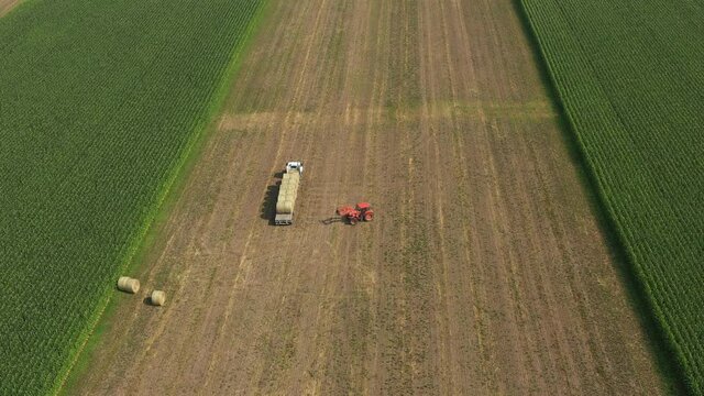 Farmer Loading Hay in Field with Farm Equipment (Wisconsin | Drone)