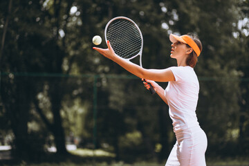 Young woman tennis player at the court