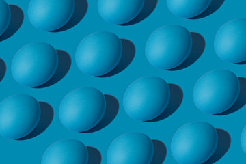 Blue eggs pattern on a blue background