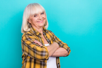 Profile side photo of cheerful aged woman crossed hands smart isolated over turquoise color background