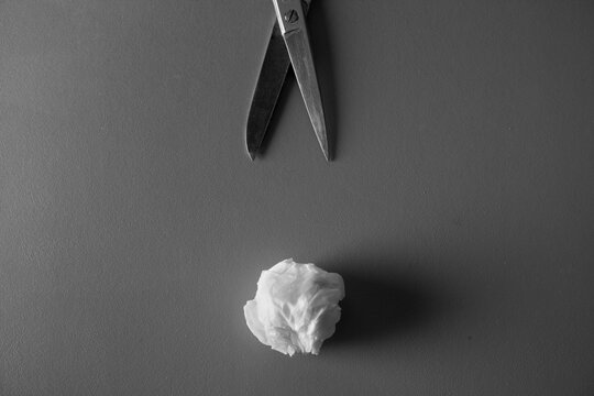 Scissors wrapped in white paper