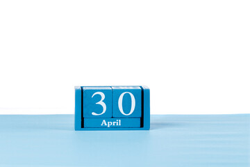Wooden calendar April 30 on a white background