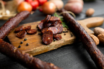 Smoked, aged sausages with fresh vegetables and food ingrediets