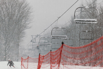 Ski Lift in Snowy and Foggy Weather