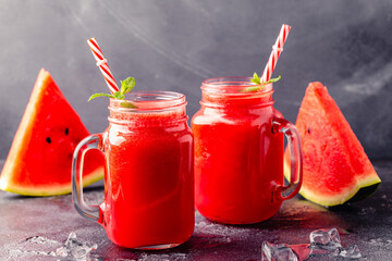 Fresh tasty delicious watermelon juice on a dark background