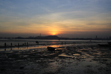 under sunset sea, scenes from hong kong to shenzhen coast at Ha Pak Nai, Yuen Long