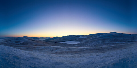 Hilly area on a winter evening.