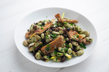 Sautéed pork loin with black pudding and broad beans.
