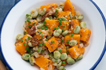 Sautéed pumpkin with broad beans. Spanish traditional tapas.
