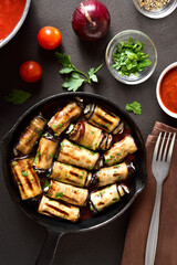 Eggplant (aubergine) rolls with cheese and greens
